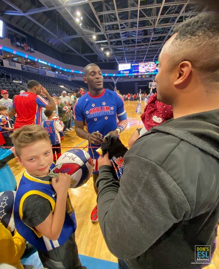 Post-game interaction with fans at a Harlem Globetrotter event.  | Don's ESL Adventure!